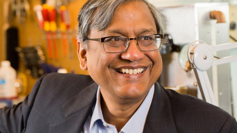 Portrait of Prof. Vijay Modi in the lab.